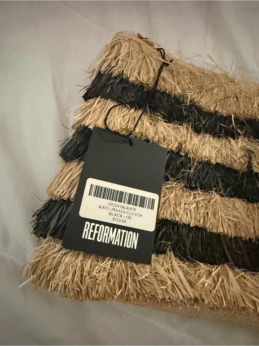 Reformation x Kayu Pinata Oversized Fringe Straw Clutch In Black